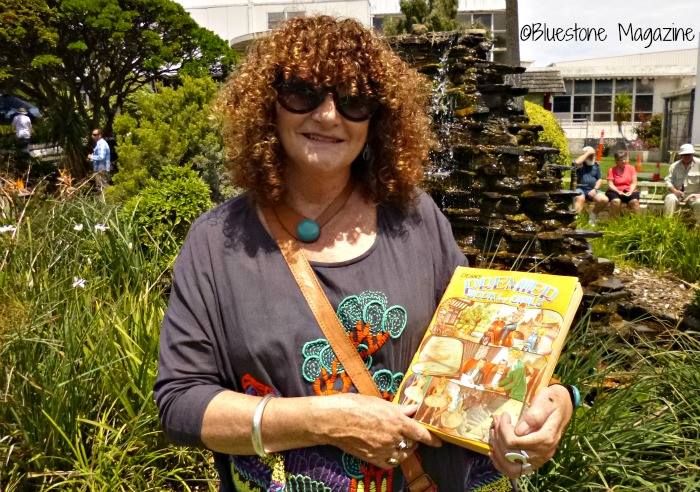 Claire Jennings (nee Gleeson) with the book she received as a kid at one of the FJ Christmas Parties in the FJ gardens.  Claire is speaking at a present day Community Christmas Party in the FJ gardens where kids also received a book present from Santa. We love this connecting of past and present that has happened with the Save the Silver Ball and Fletcher's Gardens campaign.  Photo: Bluestone Magazine