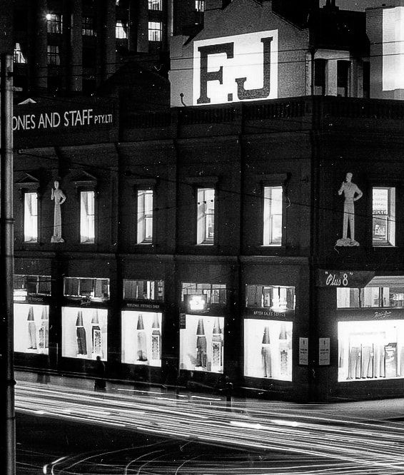 1956 view of the Flinders/Queen St Melbourne store with the Plus 8 men on the facade.  