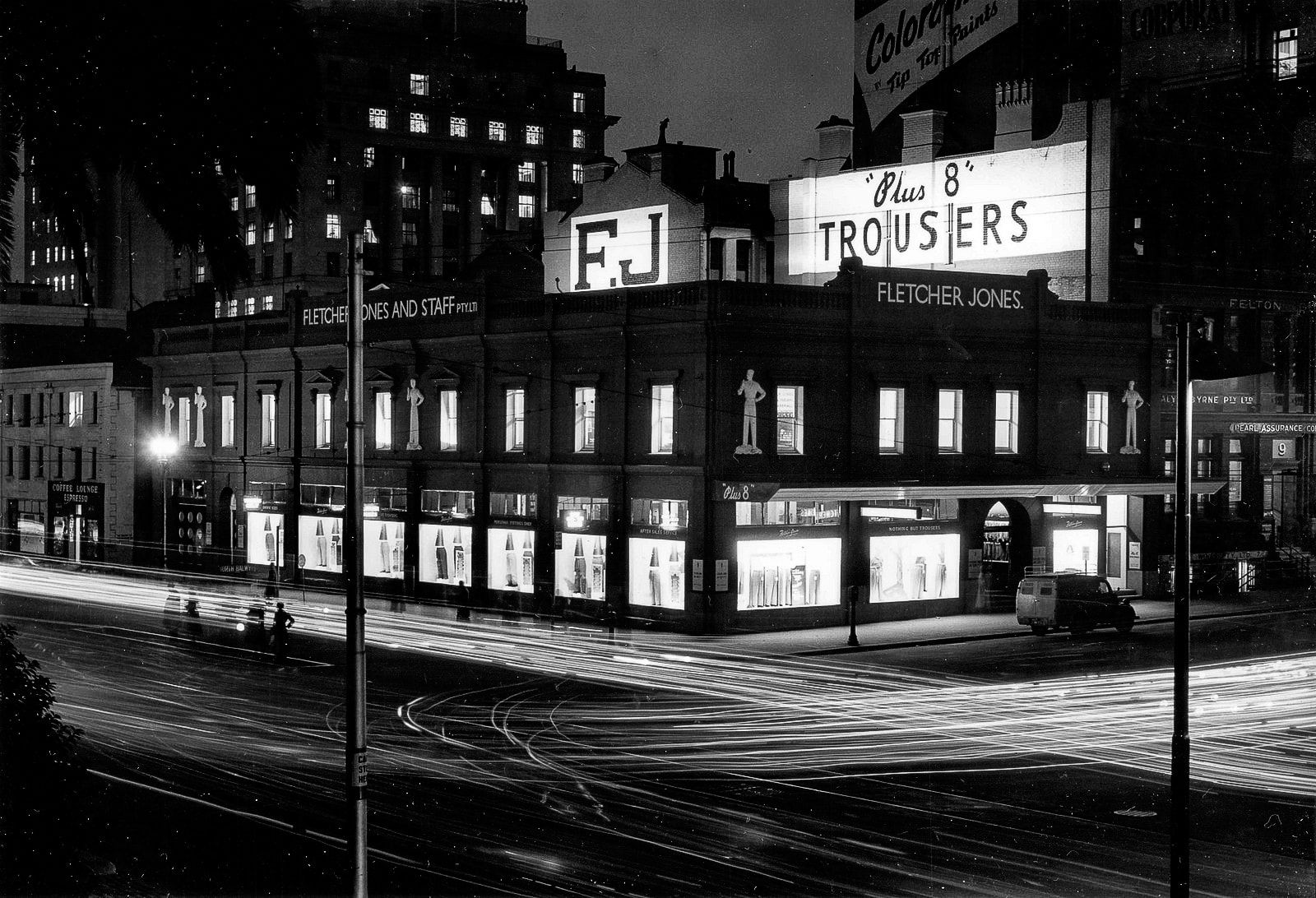 1956 view of the Flinders/Queen St Melbourne store with the Plus 8 men on the facade. 