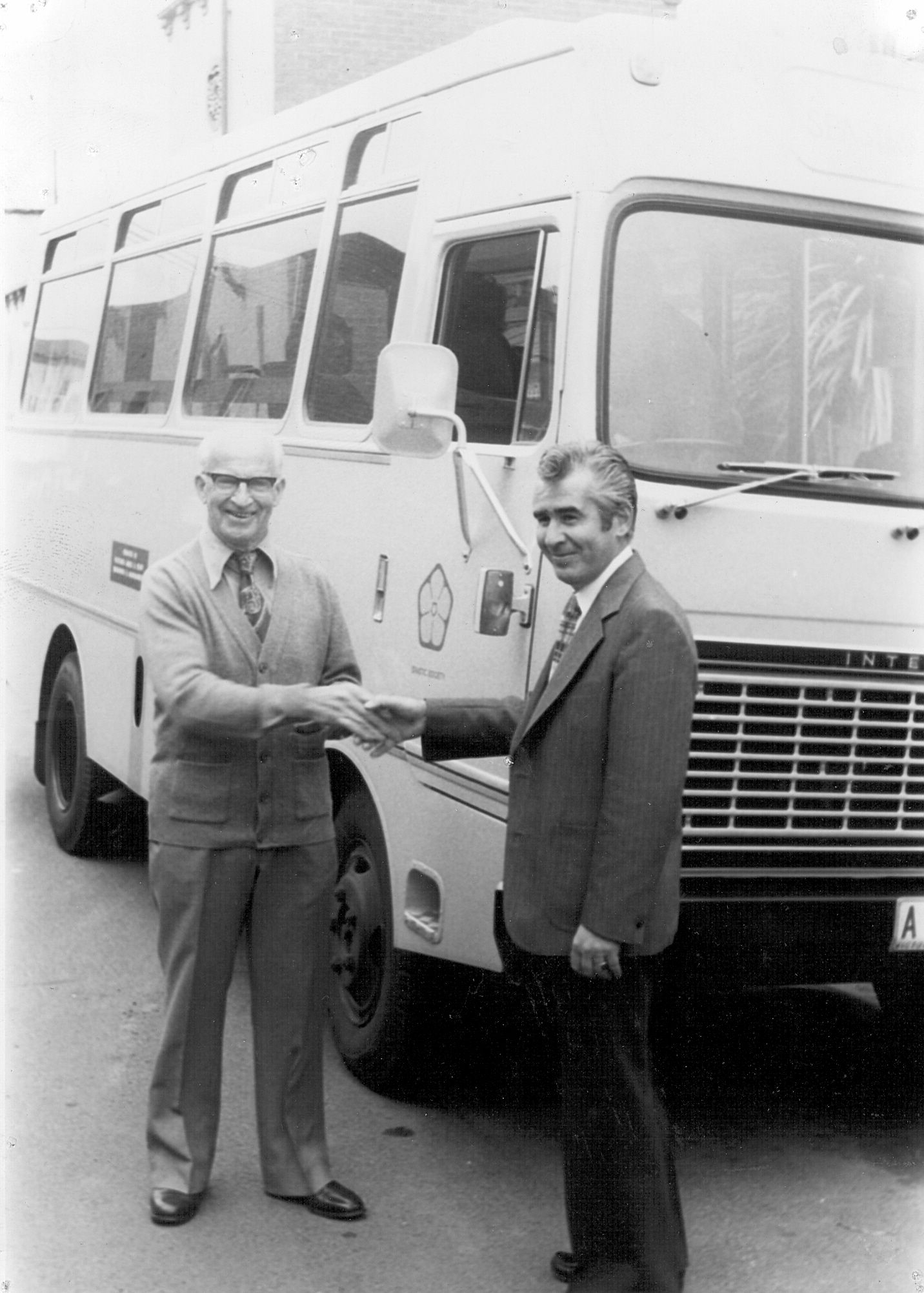 Luigi Zoran, Manager of the FJ Brunswick factory, presents a cheque to Spastic Centre towards their bus."The bus was given to the Northern Districts Spastic Centre in Pascoe Vale and is described by them as 'one of the best Christmas presents ever received."  Photo: Jones Family Collection 