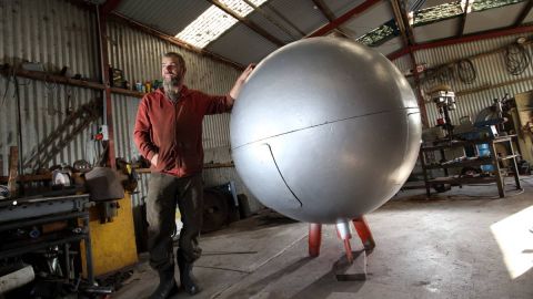  Murray Adams restoring the replica Silver Ball. Photograph by Damian White (The Standard).