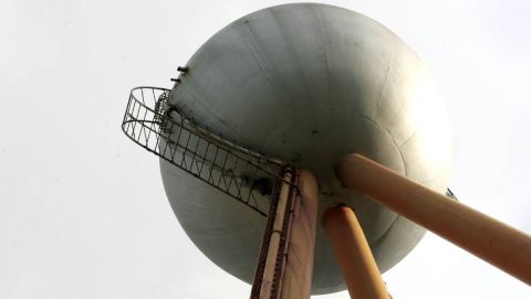 Trespassers climb the rusty ladder to get to the top the ball 2006:image Warrnambool Standard