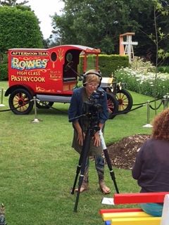 Colleen Hughson interviewing Claire Jennings with her book at the 2015 community Christmas Party in the FJ gardens. Photo:Glenys Phillpot  