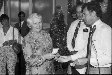 Del Clapp receiving a cheque for the Warrnambool Handicapped Support Group from Fj Staff Rep. Photo: Jones Family Collection 