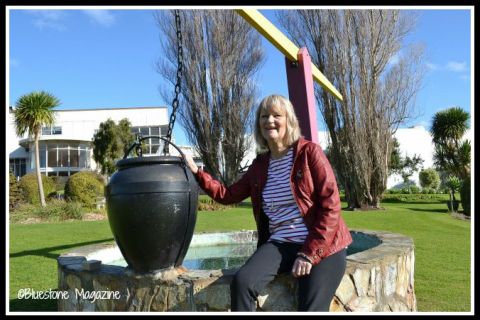 Anne Skepper Van Bakel at the wishing well in the Fletcher Jones Gardens in 2015. She was one of the little girls caught redhanded trying to collect coins from the wishing well in the Fletcher Jones gardens in the early 1970s. Photo:Bluestone Magazine.  