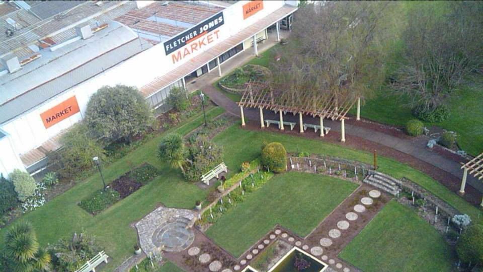 View of the FJ second hand market and gardens. The pergola has since been painted fire engine red again.   Photo: Matt Lanyon