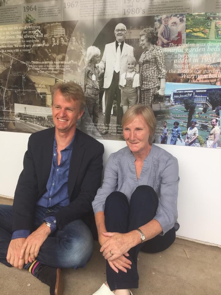 David Jones Jnr (left) and Brenda Anderton/McPeake sit in front of a photograph of them as children, taken at a 1972 FJ Staff Christmas Party in the gardens! Photo: Colleen Hughson