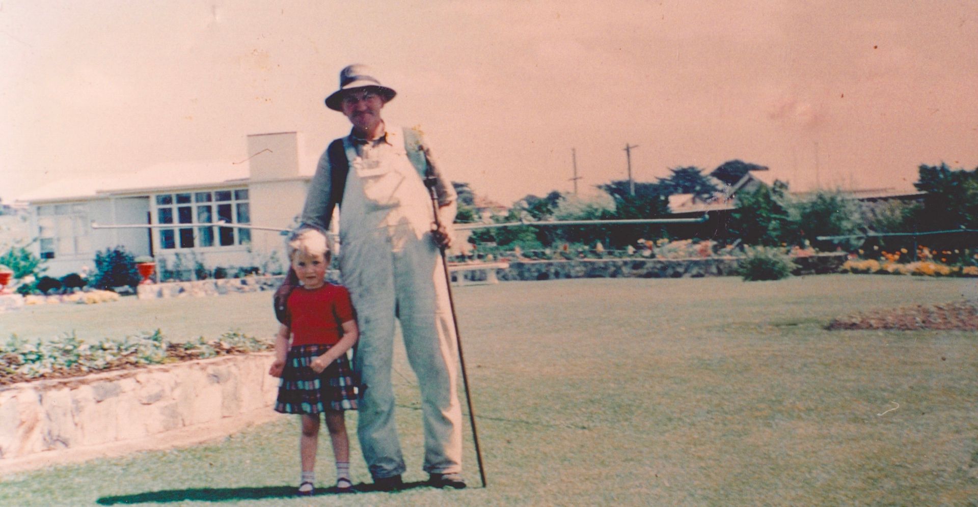 Marg O'Connor (nee Dorian) with Benny Hose in the FJ gardens where she lived as a child in one of the three staff houses.  Photo: Marg O'Connor 