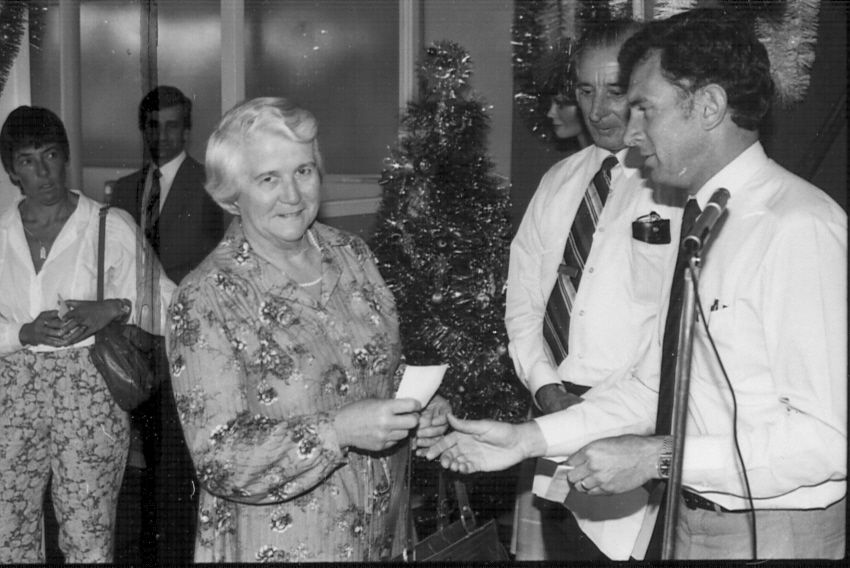 Del Clapp receiving a cheque for the Warrnambool Handicapped Support Group from Fj Staff Rep. Photo: Jones Family Collection 