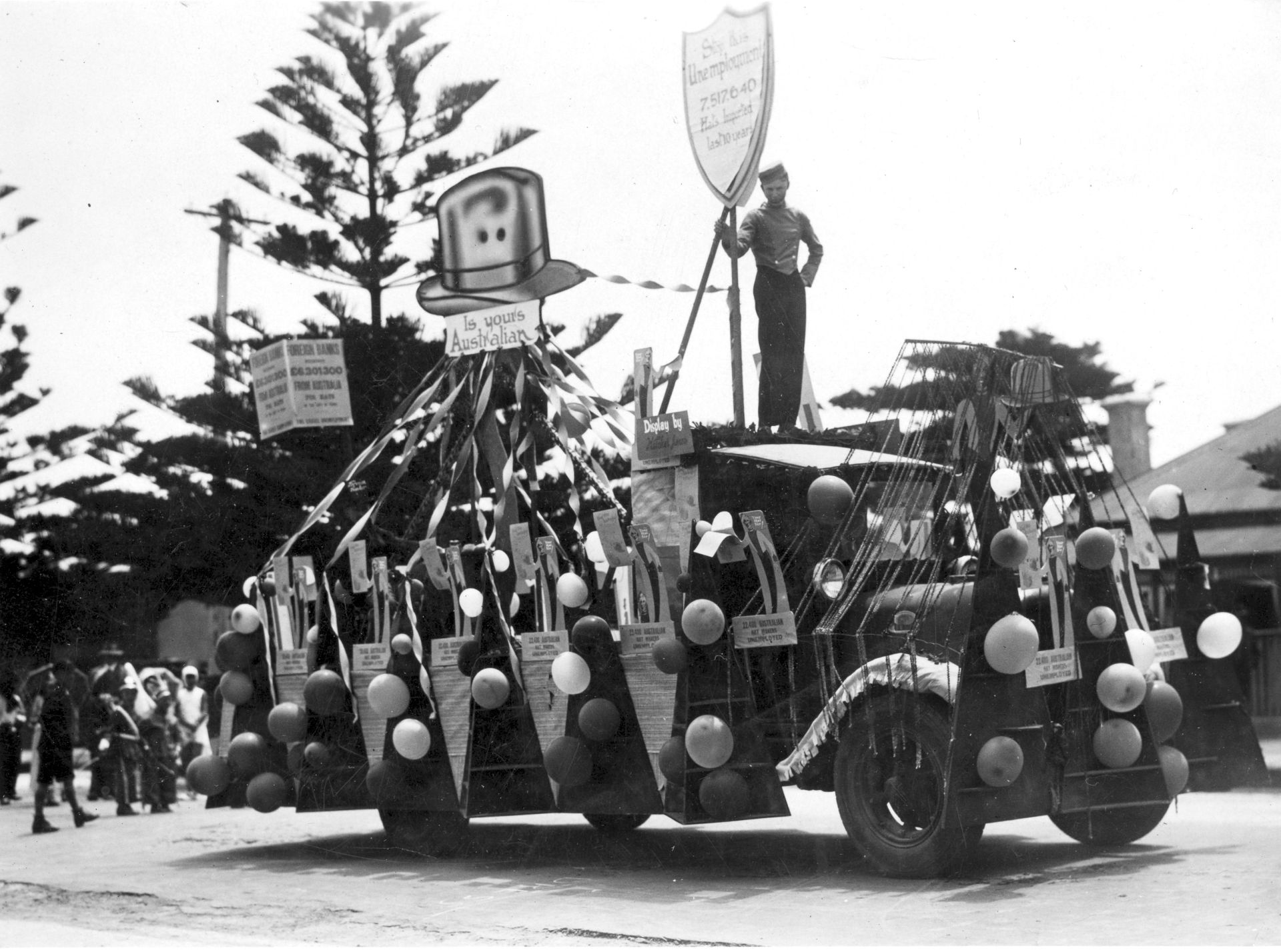 Depression era parade in Warrnambool with Fletcher Jones float topped by a hat asking "Is yours Australian?"  Photo: Jones Family Collection