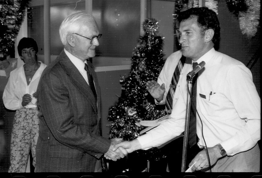 Graham Greave, FJ Staff Rep, presents a cheque to Chairman of Warrnambool Handicapped Support Group.  Photo: Jones Family Collection. 