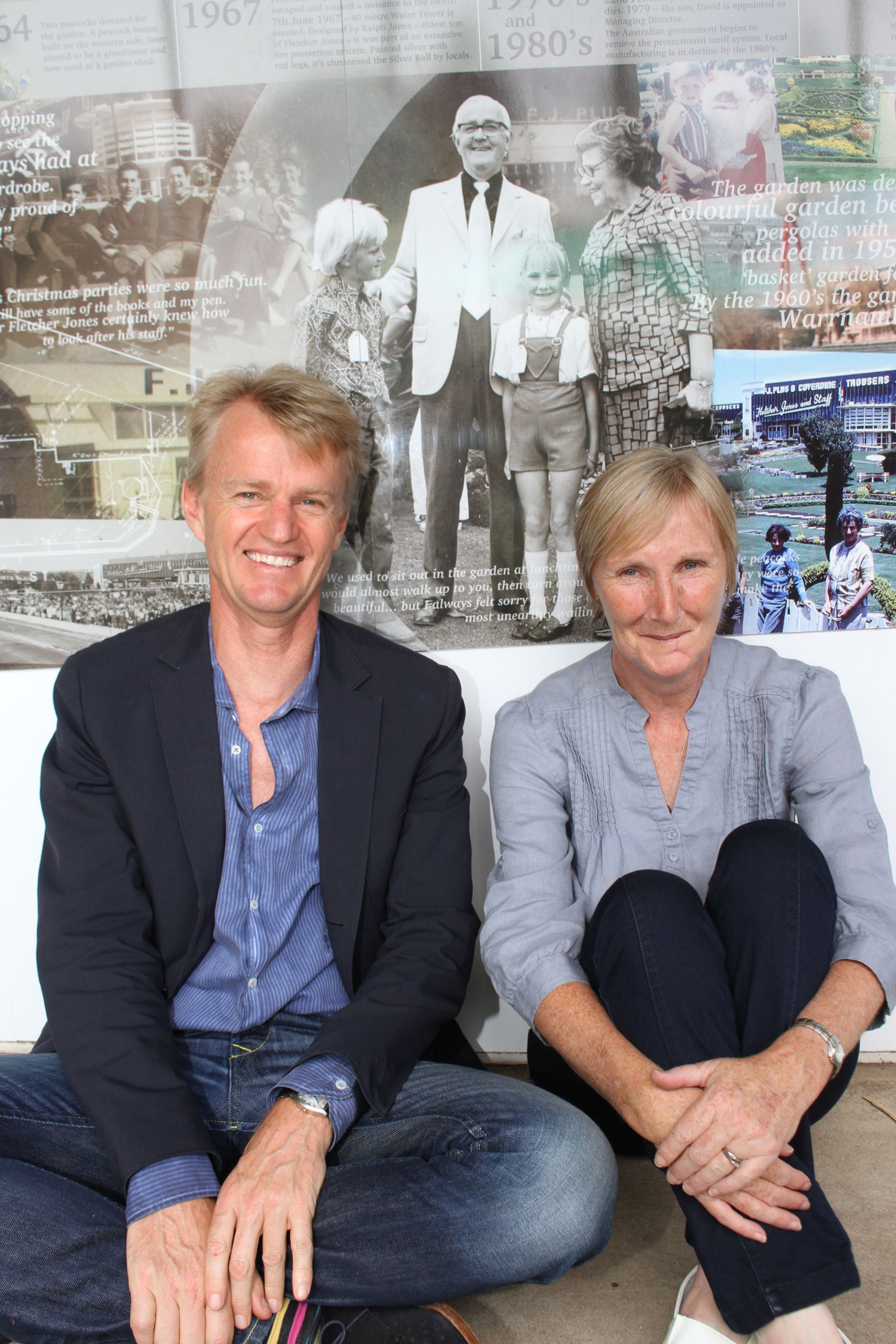 42 years later, David Jones and Brenda Anderson in front of the photo of them as children at a FJ Christmas picnic.  This photo was taken at a 2015 community Christmas picnic in the gardens when the first Fletcher Jones Stories Panel was unveiled.  Photo: Colleen Hughson 