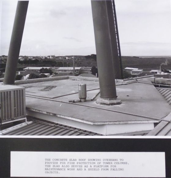 The concrete slab roof showing overhang to provide for fire protection of tower columns.   The slab also serves as a platform for maintenance work and a shield from falling objects. 