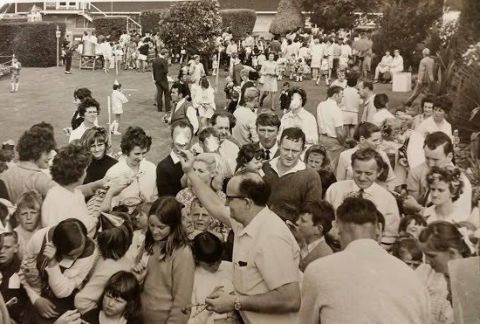 That’s Bernie Davey (with the glasses) from the Fletcher Jones cutting room giving away the party favours . He was also the train driver for the train rides at the Christmas parties! Kids got a book and when they got a bit older they got a pen! Lots of people have really great memories of these staff parties in the FJ gardens. Photo courtesy of Lost Warrnambool.  