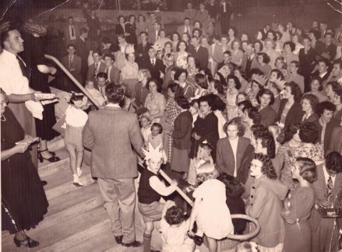 George Doreian and Margaret Dunne left giving out Christmas presents. Photo: Ralph Illidge (shared by Marg O'Connor)