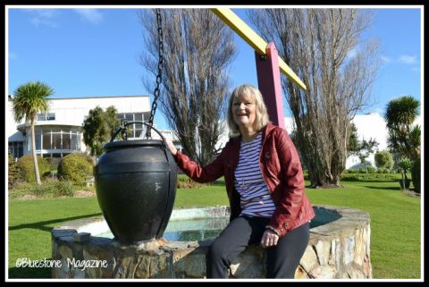 Anne Skepper Van Bakel at the wishing well in the Fletcher Jones Gardens in 2015. She was one of the little girls caught redhanded trying to collect coins from the wishing well in the Fletcher Jones gardens in the early 1970s. Photo:Bluestone Magazine.  