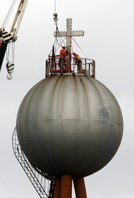 The cross is placed on top of the ball in 2006: image Warrnambool Standard