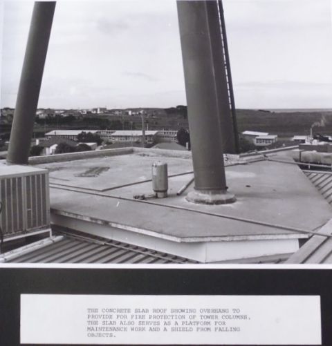 The concrete slab roof showing overhang to provide for fire protection of tower columns.   The slab also serves as a platform for maintenance work and a shield from falling objects. 