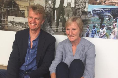 David Jones Jnr (left) and Brenda Anderton/McPeake sit in front of a photograph of them as children, taken at a 1972 FJ Staff Christmas Party in the gardens! Photo: Colleen Hughson