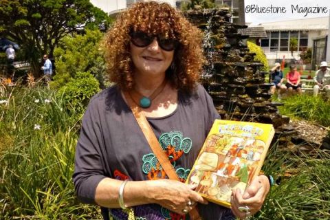 Claire Jennings (nee Gleeson) with the book she received as a kid at one of the FJ Christmas Parties in the FJ gardens.  Claire is speaking at a present day Community Christmas Party in the FJ gardens where kids also received a book present from Santa. We love this connecting of past and present that has happened with the Save the Silver Ball and Fletcher's Gardens campaign.  Photo: Bluestone Magazine