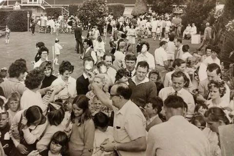 That’s Bernie Davey (with the glasses) from the Fletcher Jones cutting room giving away the party favours . He was also the train driver for the train rides at the Christmas parties! Kids got a book and when they got a bit older they got a pen! Lots of people have really great memories of these staff parties in the FJ gardens. Photo courtesy of Lost Warrnambool.  